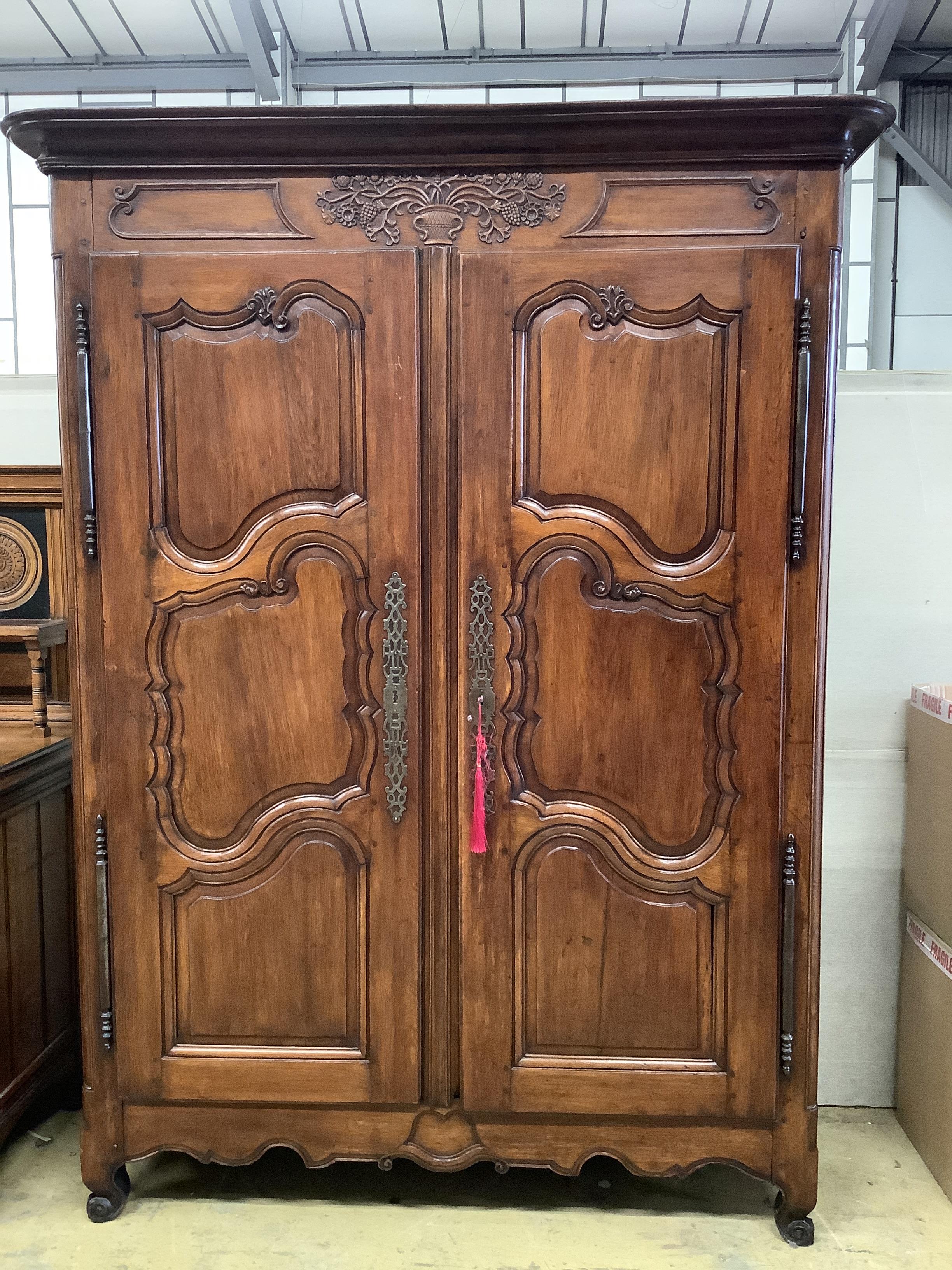 An 18th century French oak armoire, width 168cm, depth 62cm, height 216cm